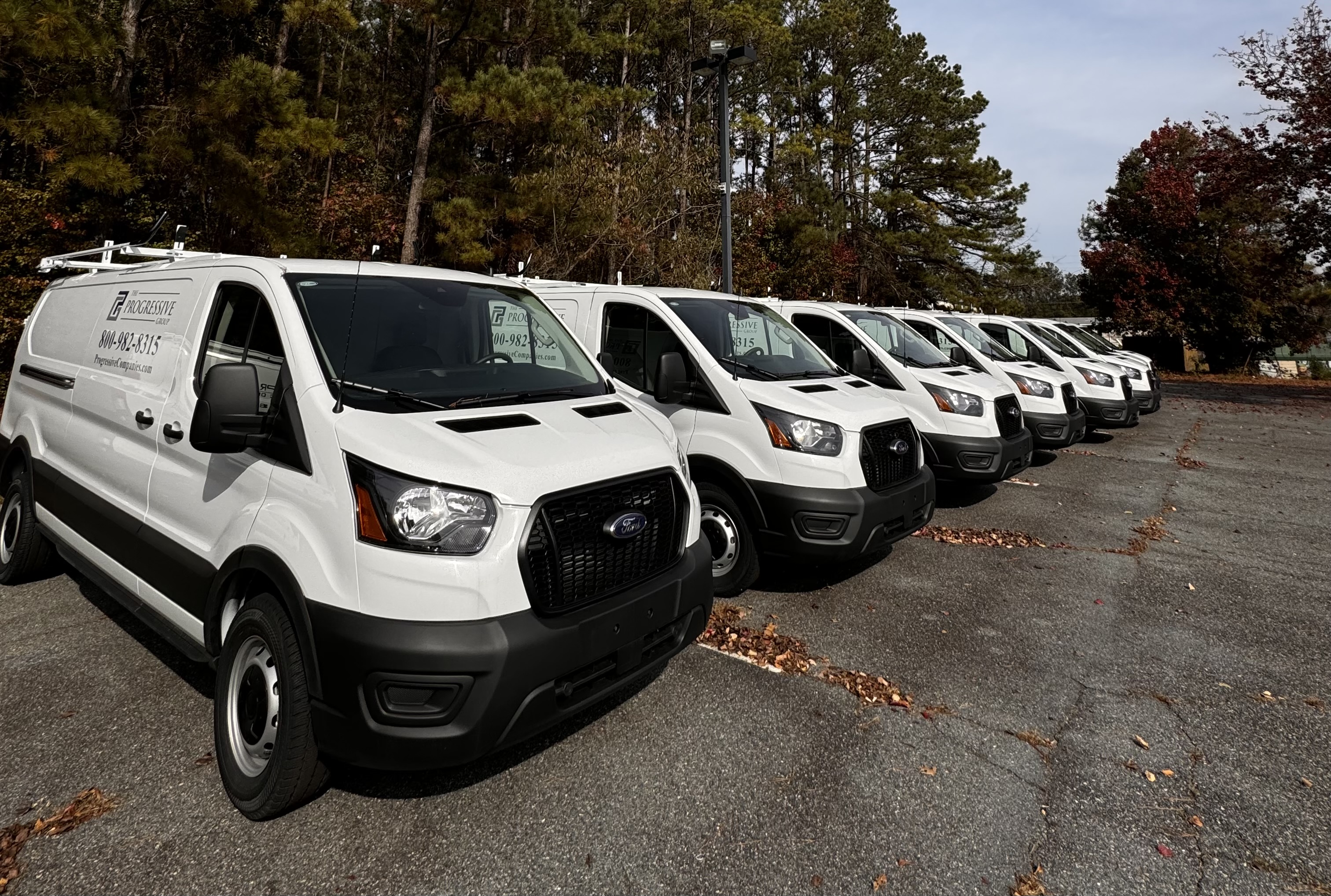 Tracked service vans lined up outside